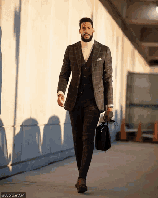 a man in a suit is walking down a street with a briefcase