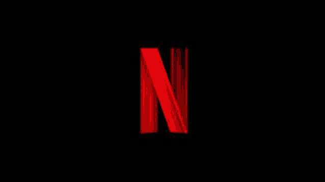 the netflix logo is red and glowing in the dark .