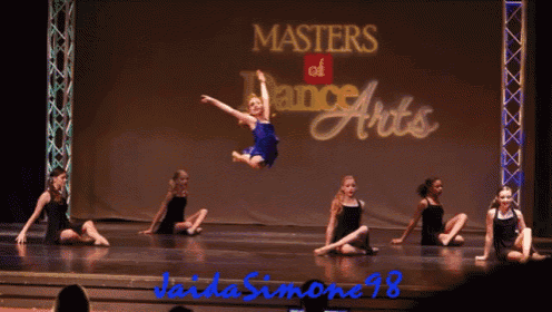 a group of young girls are performing on stage in front of a sign that says masters of dance arts