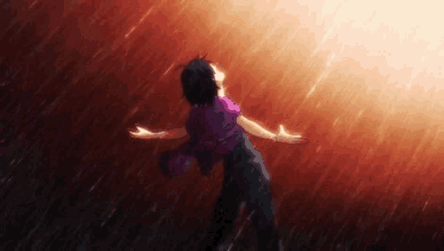 a person is standing in the rain with their arms outstretched and a purple shirt on .