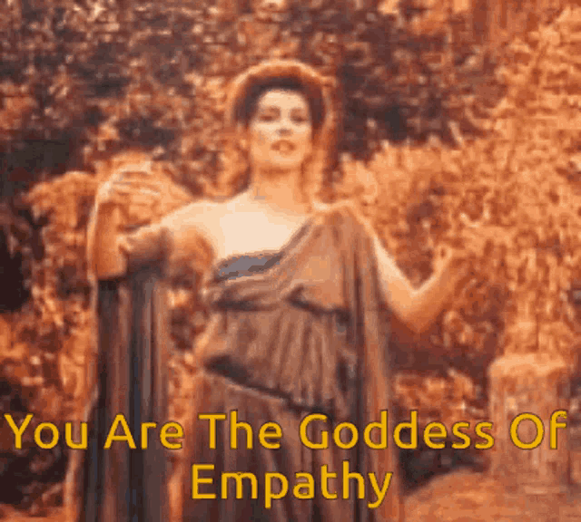 a woman is standing in front of trees with the words " you are the goddess of empathy " written below her