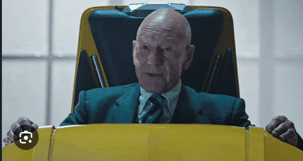 an older bald man in a suit and tie is sitting in a yellow chair