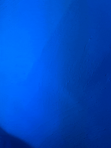 a blue background with a shadow of a person