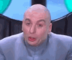 a close up of a bald man making a funny face