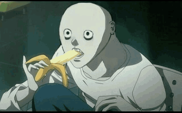 a bald man is eating a banana with a strange face .