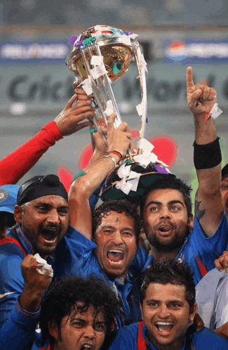 a group of men are holding a trophy in their hands