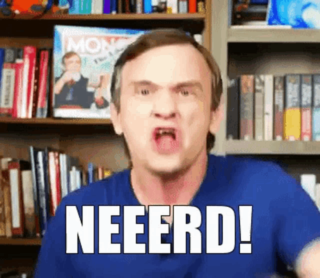 a man in a blue shirt says neeerd in front of bookshelves