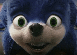 a close up of sonic the hedgehog 's face with big green eyes .