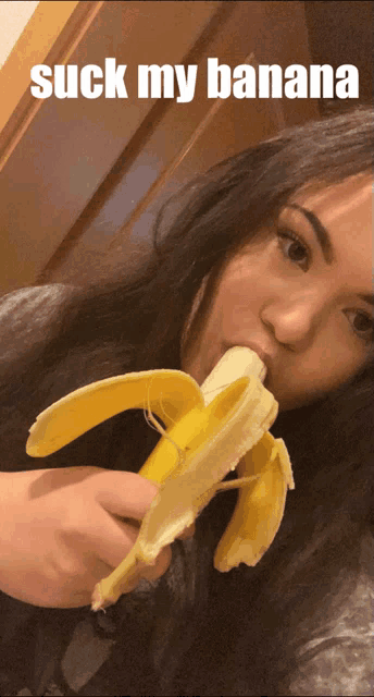 a woman is eating a banana with the words suck my banana above her