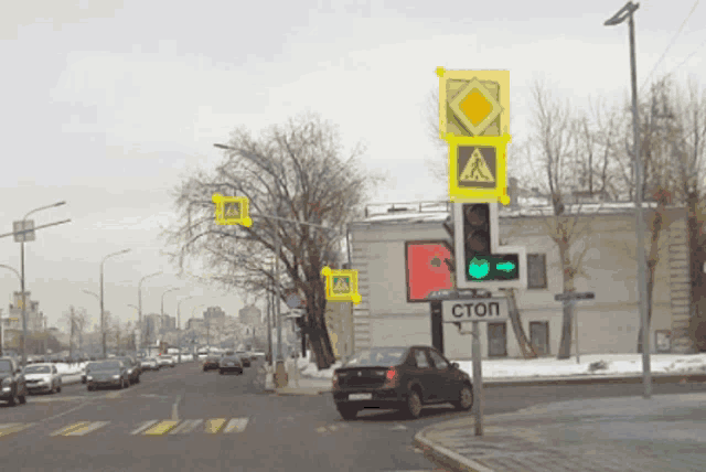 a car is driving down a street with a stop sign in front of it