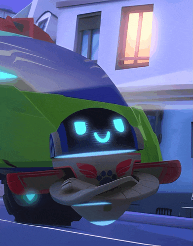 a green and blue cartoon vehicle with a smiley face on it