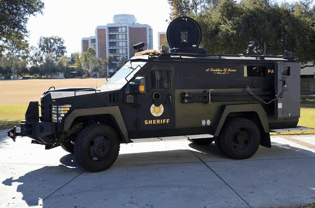 a sheriff 's vehicle is parked on a sidewalk