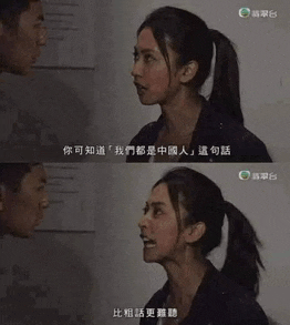 a woman in a ponytail talks to a man in a foreign language