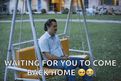 a man is sitting on a swing with the words waiting for you to come back home