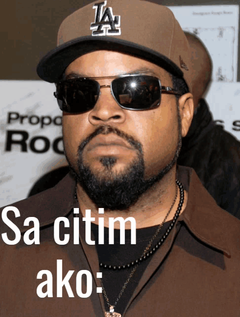 ice cube wearing a la hat and sunglasses says sa citim ako