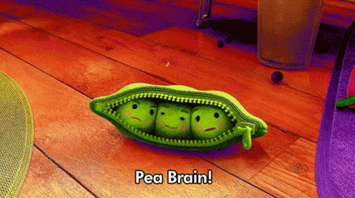 three peas in a pod are sitting on a wooden floor and saying pea brain .