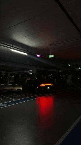 a car is parked in a parking garage with a handicapped parking space