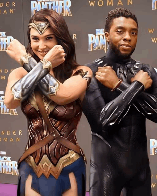 wonder woman and black panther are posing for a photo