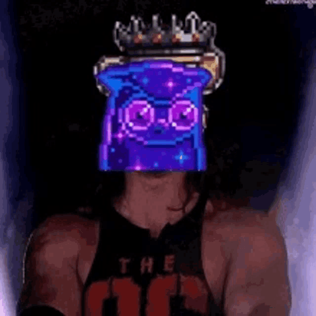 a man wearing a purple mask with a crown on it .