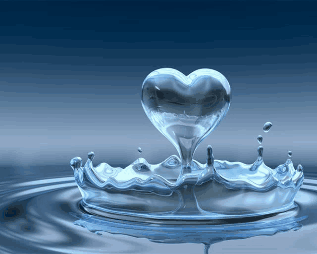 a splash of water with a heart shaped drop of water coming out of it