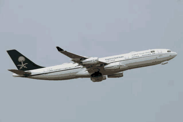 a king abdul aziz airplane flies through the air