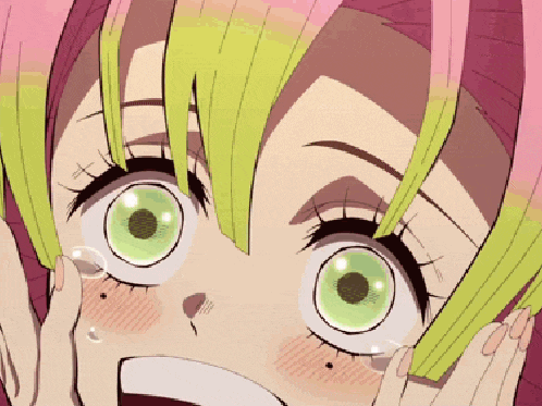 a close up of a person 's face with pink hair and green eyes .