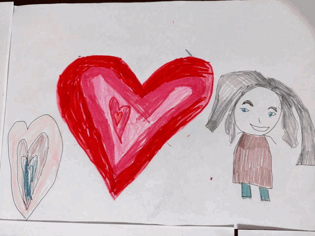 a child 's drawing of two hearts and a woman