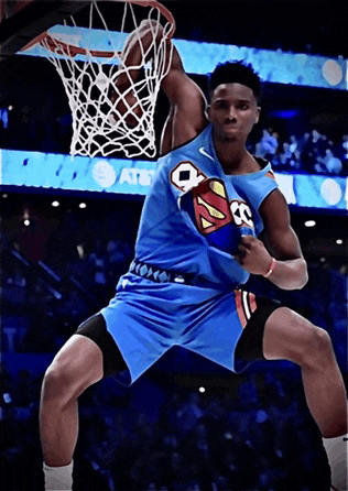 a basketball player wearing a blue jersey with the number 8 on it dunks the ball