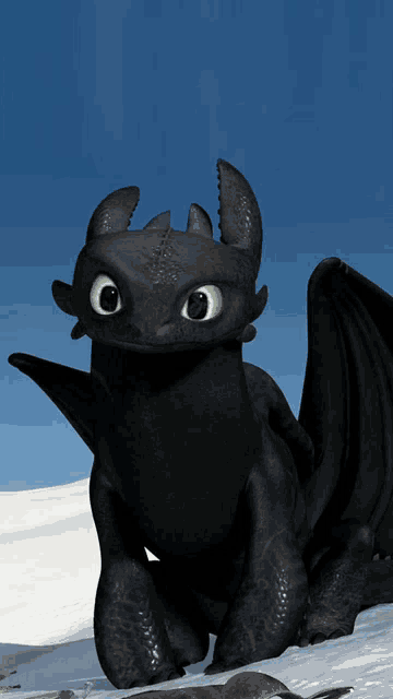 a toothless from how to train your dragon is sitting in the snow