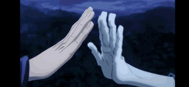 two hands are giving each other a high five in a dark scene