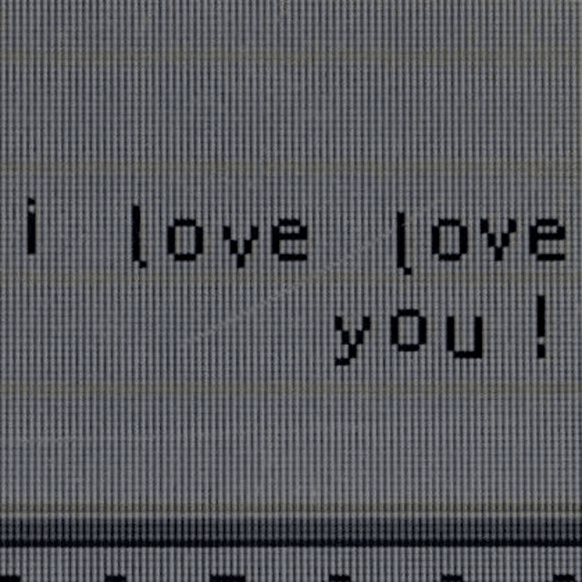 a close up of a computer screen with the words `` i love you '' on it .