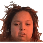 a woman with dreadlocks is making a funny face with her mouth open .