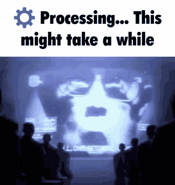a group of people watching a screen that says processing this might take a while