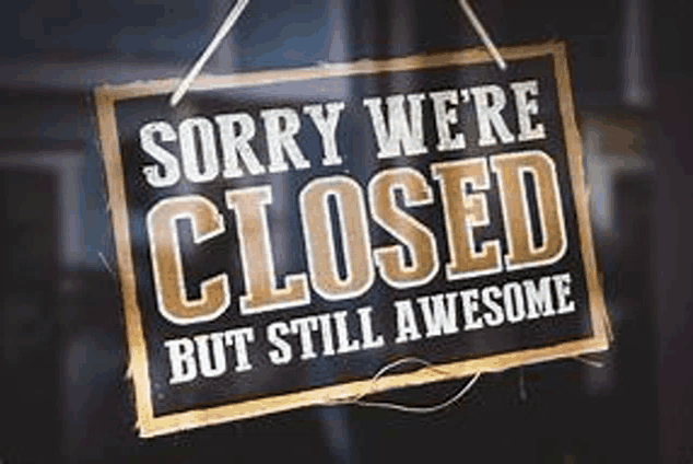 a closed sign that says `` sorry we 're closed but still awesome '' is hanging on a window .