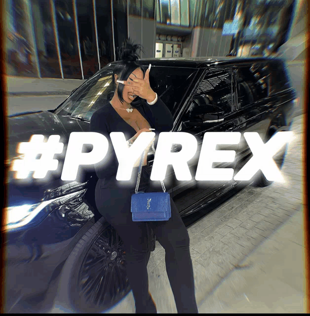 a woman standing in front of a black car with #pyrex written in white