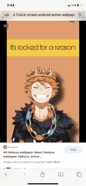 a phone screen shows a picture of a anime character with a crown on his head .