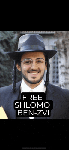 a man wearing a hat and glasses with the words free shlomo ben-zvi