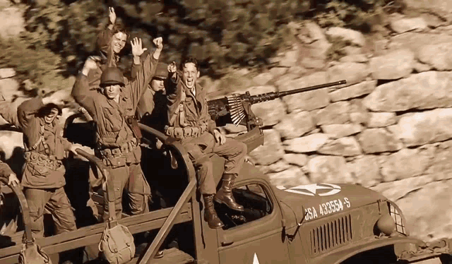 a group of soldiers are riding in the back of a truck with the number 25a a33554-5 on the side