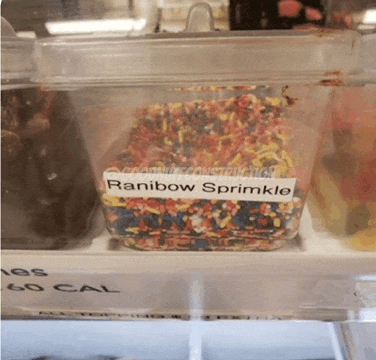 a container of rainbow sprinkles sits on a shelf