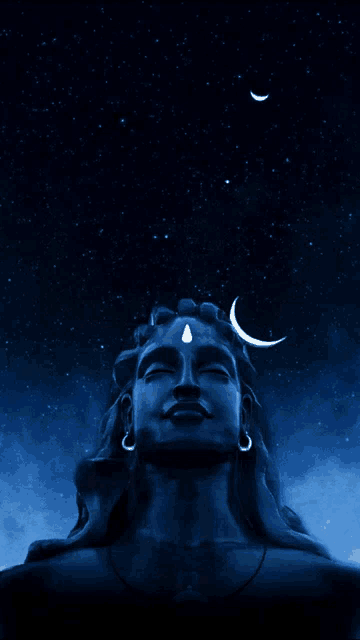 a statue of shiva with a crescent moon in the sky