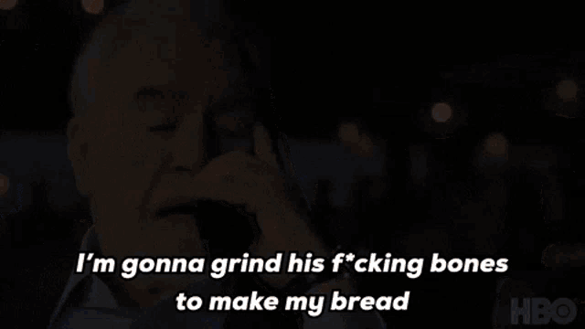 a man is talking on a cell phone and saying i 'm gonna grind his fucking bones to make my bread