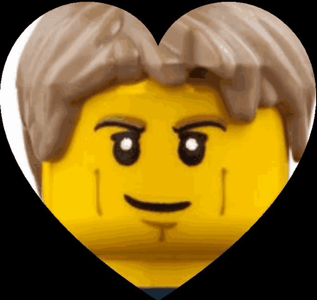 a close up of a lego head in a heart shape