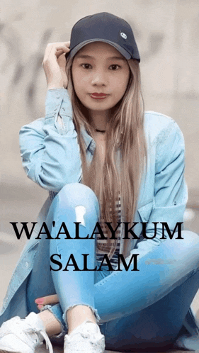 a woman wearing a hat sits on the ground with the words wa'alaykum salam on the bottom