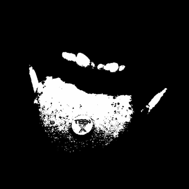 a black and white image of a person 's mouth with a teep x logo