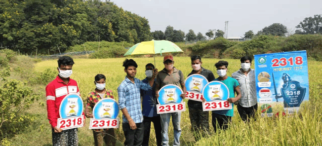 a group of people holding up signs with the number 2318 on them