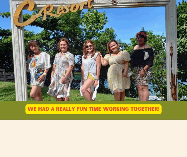 a group of women are posing for a picture under a c resort sign