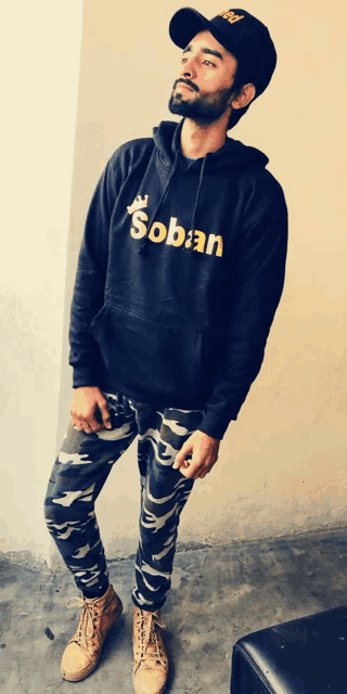 a man wearing a hoodie that says soban