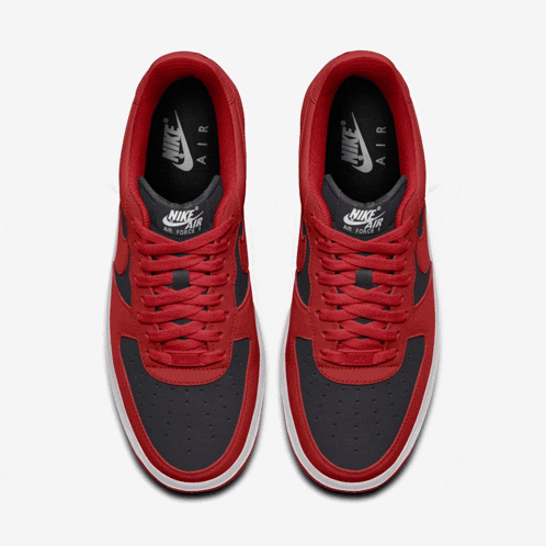 a pair of red and black nike air force 1 low sneakers