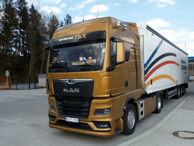 a man truck with a tgx sticker on the windshield