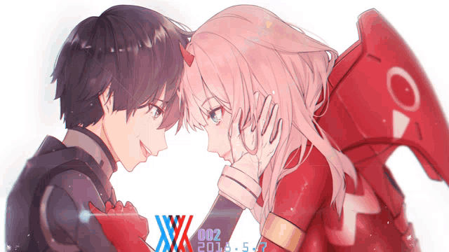 a boy and a girl are standing next to each other and the girl is wearing a red outfit that says 002